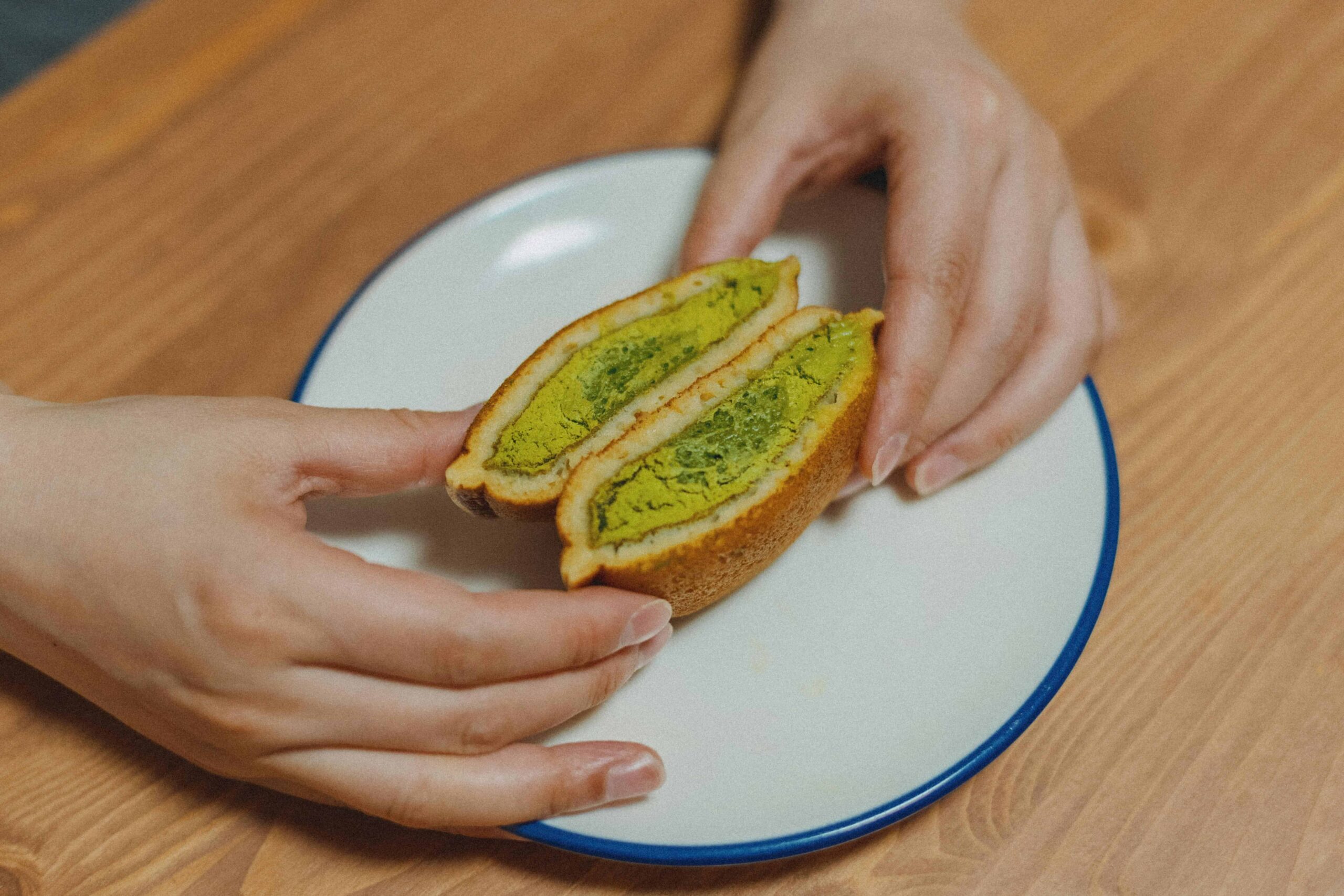 Food In Japan - 9 A matcha dorayaki split in half, revealing the sweet matcha filling inside.