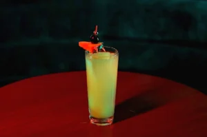 Signature cocktail with cherry garnish at Night Hawk.