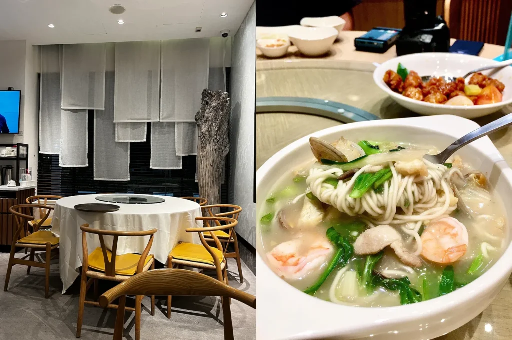 A minimalist private dining room with a round table and a close-up of a bowl of seafood noodle soup with shrimp and clams.