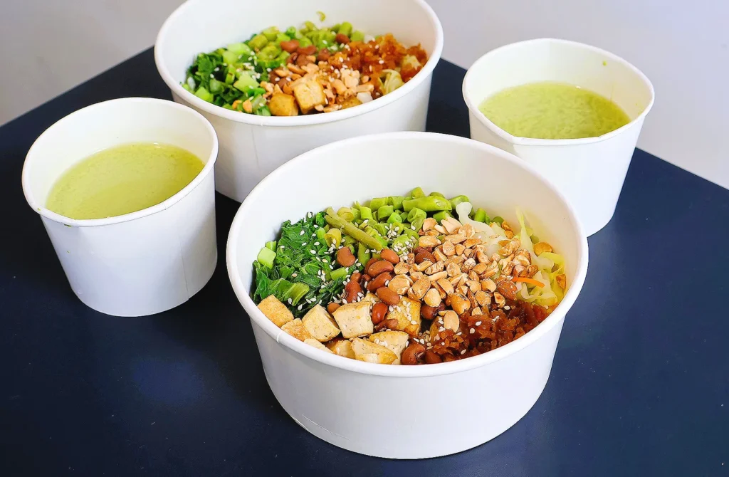 Vegetarian rice bowls with tofu, greens and healthy soup in Singapore