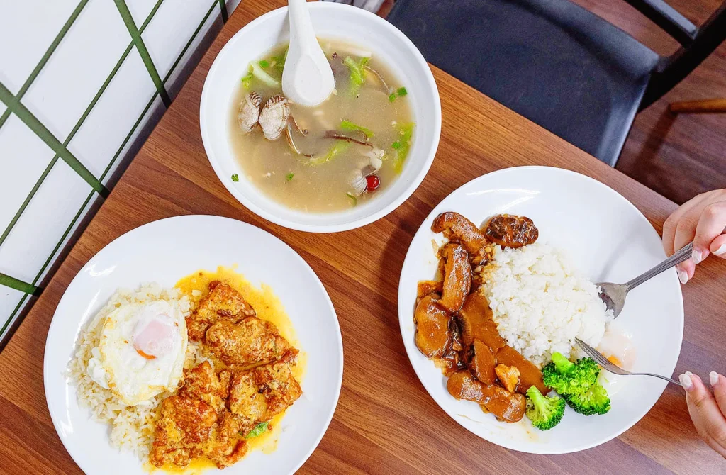Rice plates with chicken curry and herbal soup at New Station Rice Bar