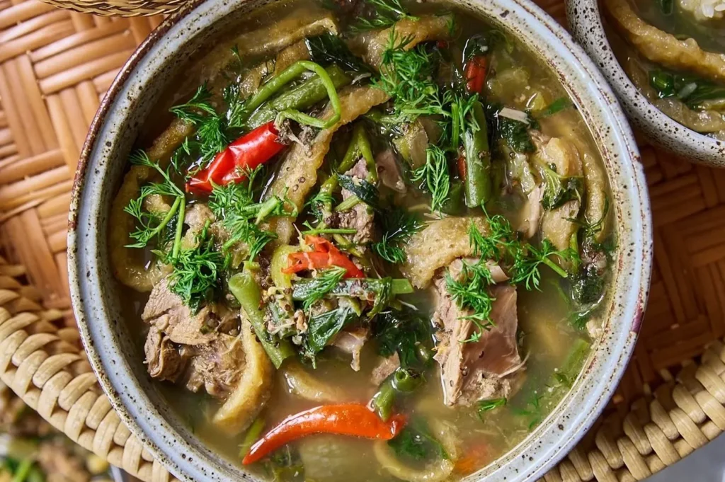 Authentic Luang Prabang or lam featuring vegetables, herbs, and buffalo stew ingredients