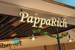 PappaRich restaurant storefront with illuminated signage.