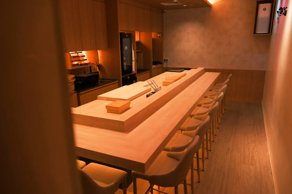 Minimalist sushi omakase counter at Sushi Masa by Ki-setsu in Singapore with warm wood interiors and intimate chef seating.