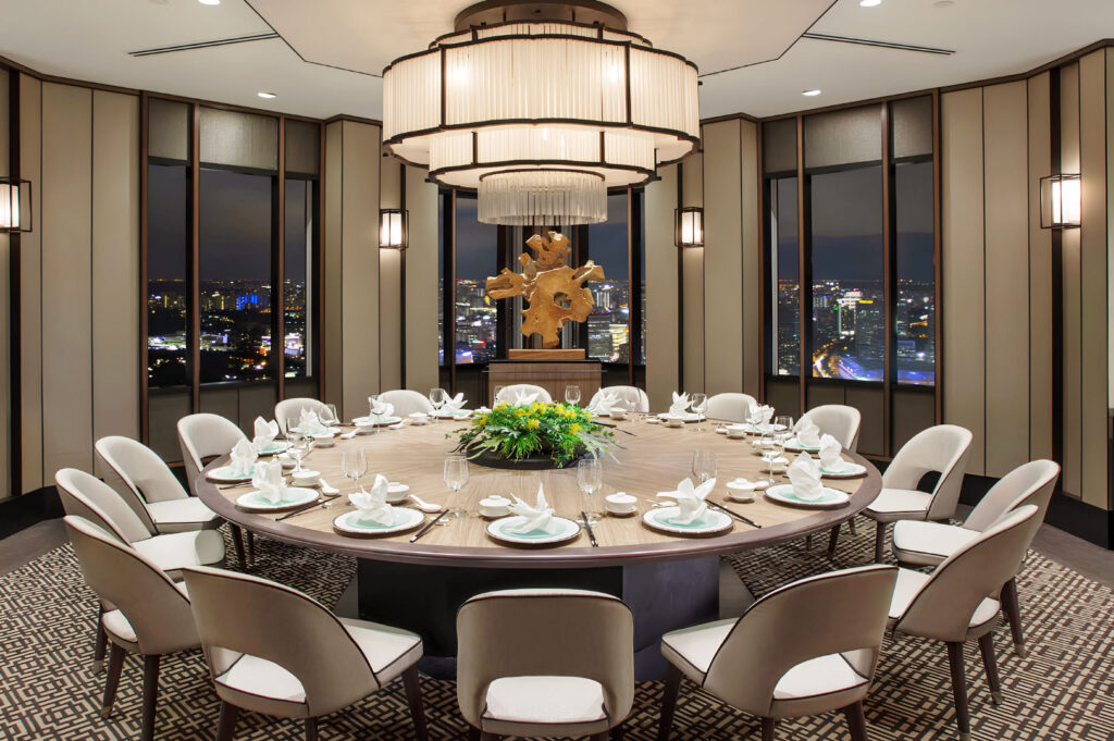 Luxury private dining room at Si Chuan Dou Hua Restaurant Singapore with panoramic city skyline views and elegant round table setup for fine Chinese dining