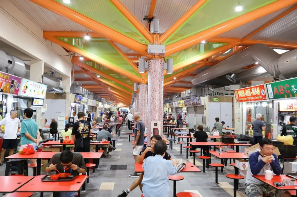 Renovated dining area inside ABC Brickworks Food Centre with hawker stalls and communal seating in Singapore