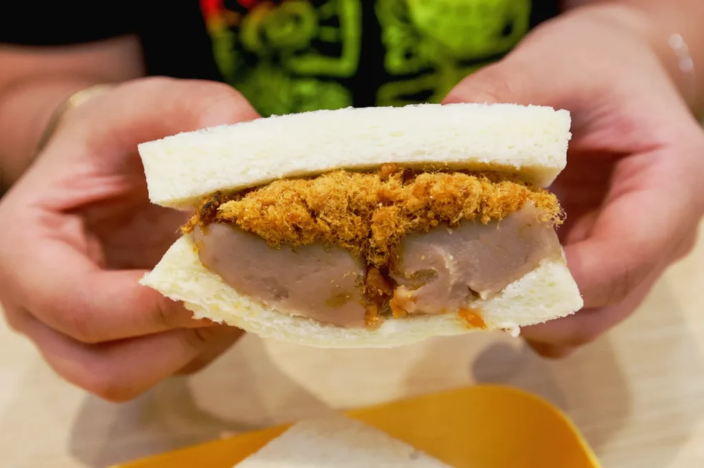 Taiwanese gua bao sandwich at Eat 3 Bowls Bendemeer filled with pork cutlet and fluffy steamed bread