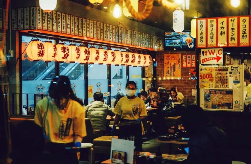 Izakaya Nijumaru Singapore lively Japanese izakaya restaurant with lantern decor, traditional menu boards and vibrant nightlife dining
