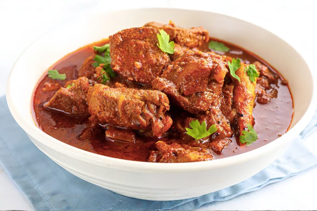 Traditional Malaysian chicken curry with tender chicken pieces in a rich spiced gravy.