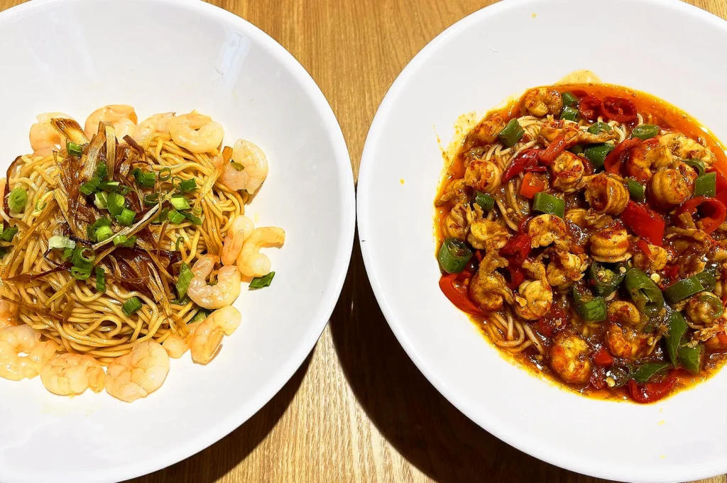 Hi Noodle Singapore handmade noodle dishes with dry shrimp noodles and spicy seafood noodles served with fresh prawns and house-made sauces
