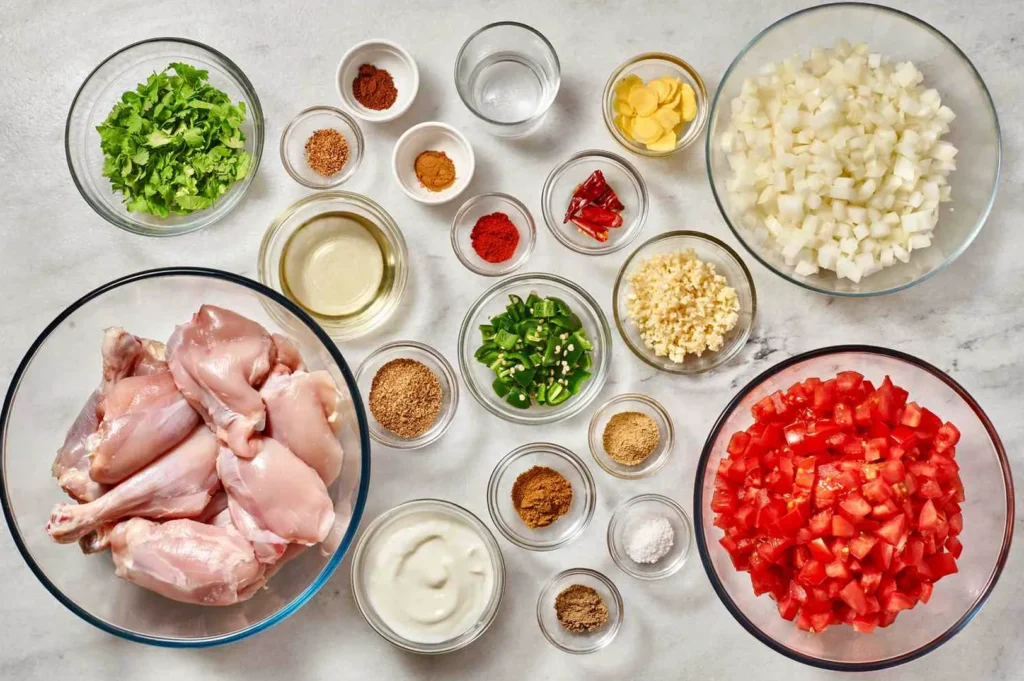 Fresh ingredients for one-pan chicken curry with jeera rice and cucumber raita