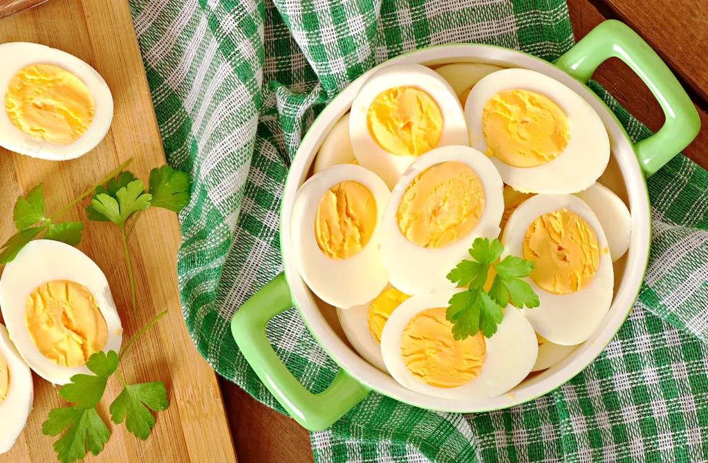 Cooked salted duck eggs with creamy yolks arranged in a bowl, highlighting the key ingredient used in salted egg sauce recipes across Asia