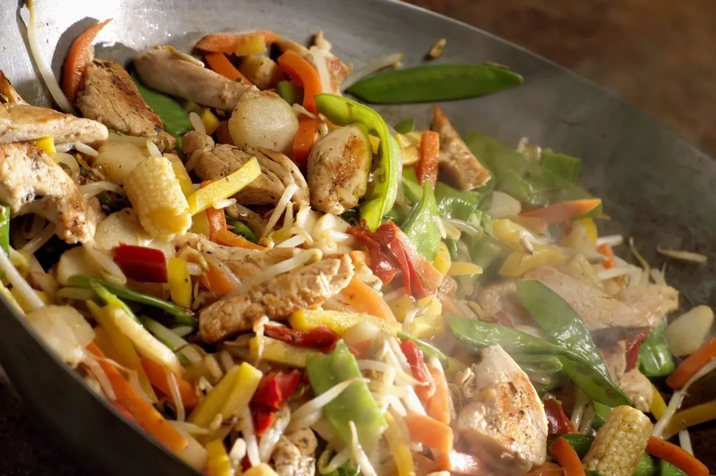 Chicken vegetable stir-fry with sesame oil.