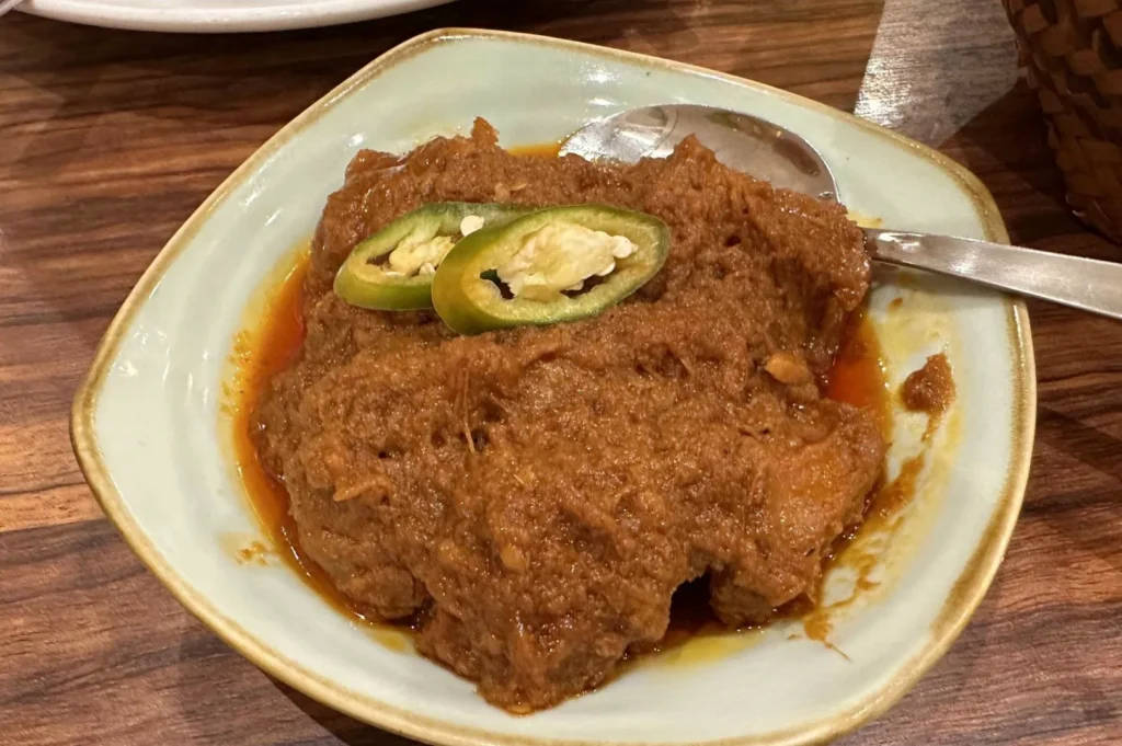 Authentic Indonesian beef rendang slow-cooked in rich coconut spices.