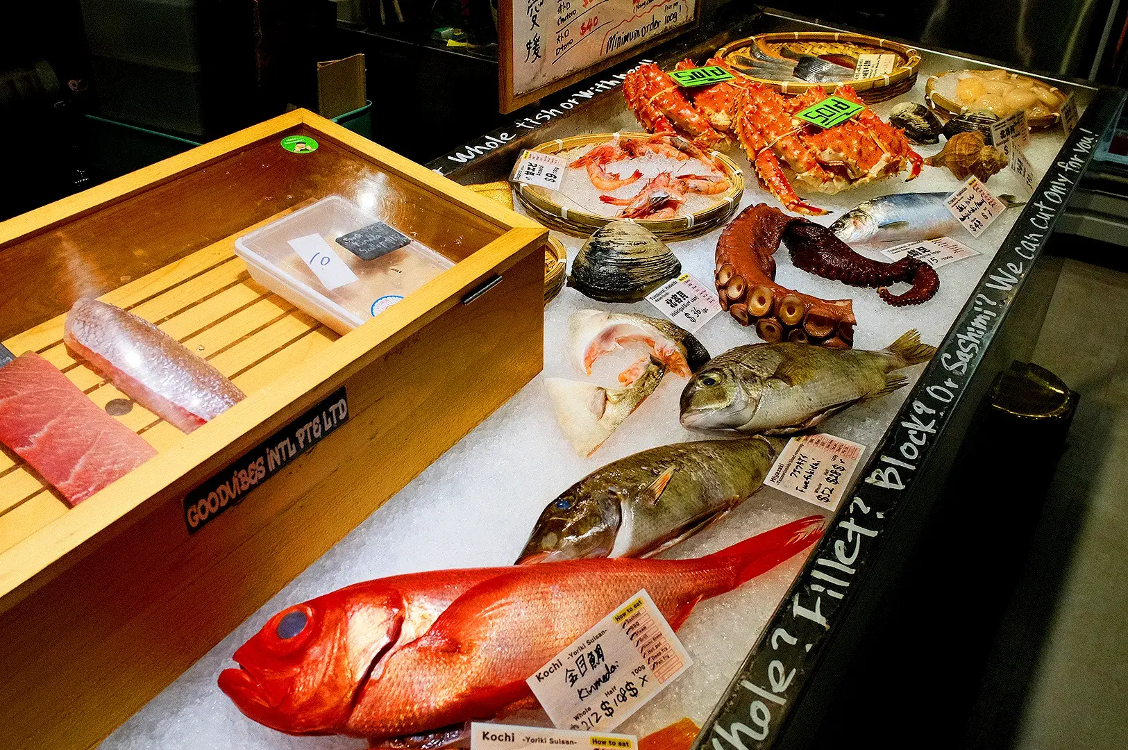 Japanese seafood market display at Araya Shouten Singapore featuring fresh fish, prawns, octopus, shellfish and king crab