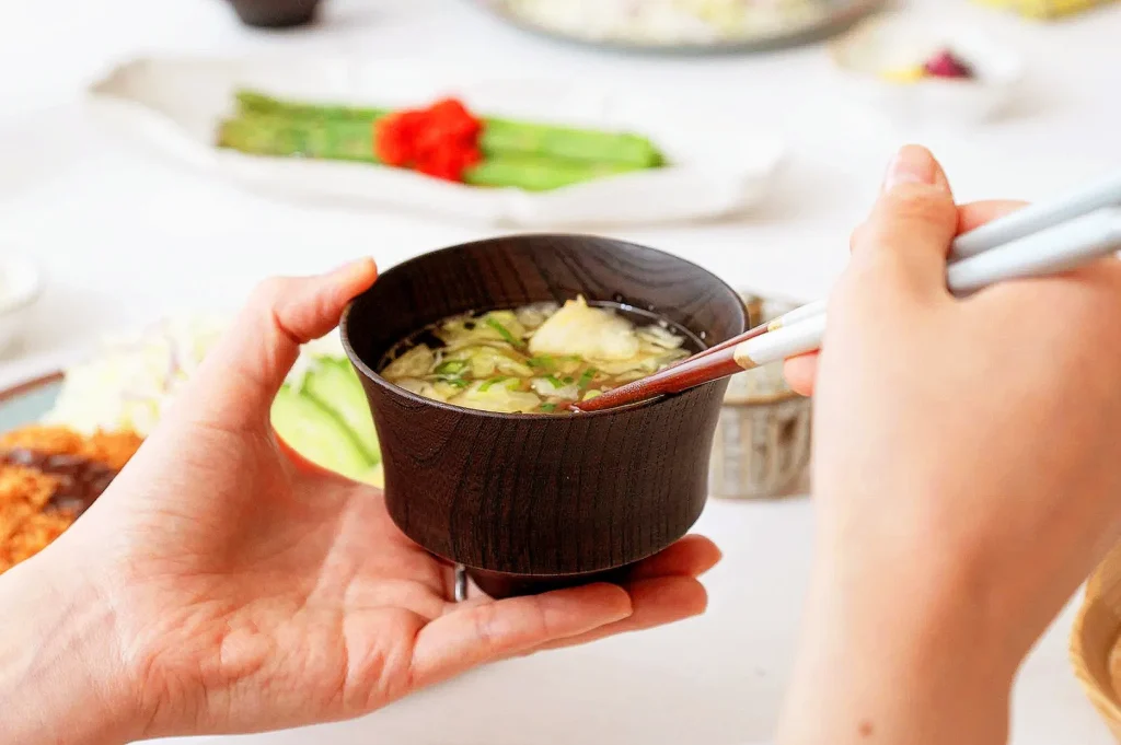 Japanese miso soup served in a traditional bowl at a Tokyo breakfast shop