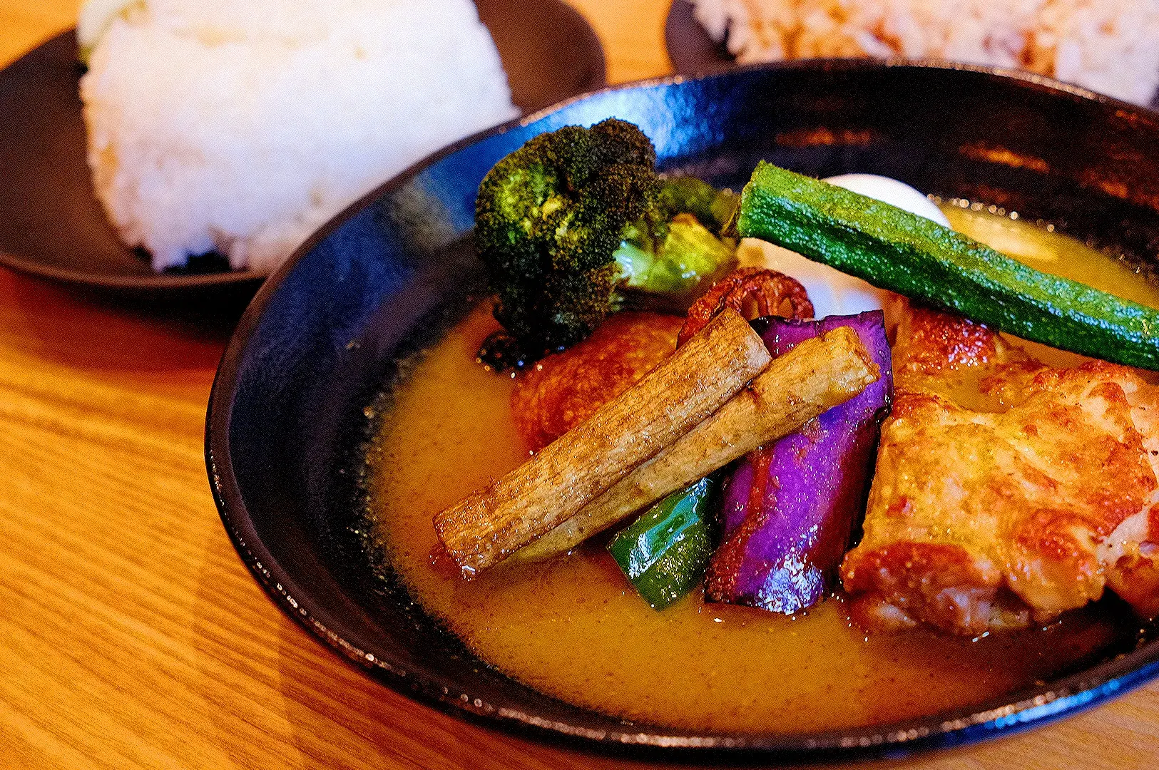 Japanese soup curry with grilled chicken, broccoli, zucchini, eggplant and vegetables served with rice at Ki-setsu Singapore
