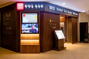 SBCD Korean Tofu House restaurant entrance with Korean signage and warm wood interior