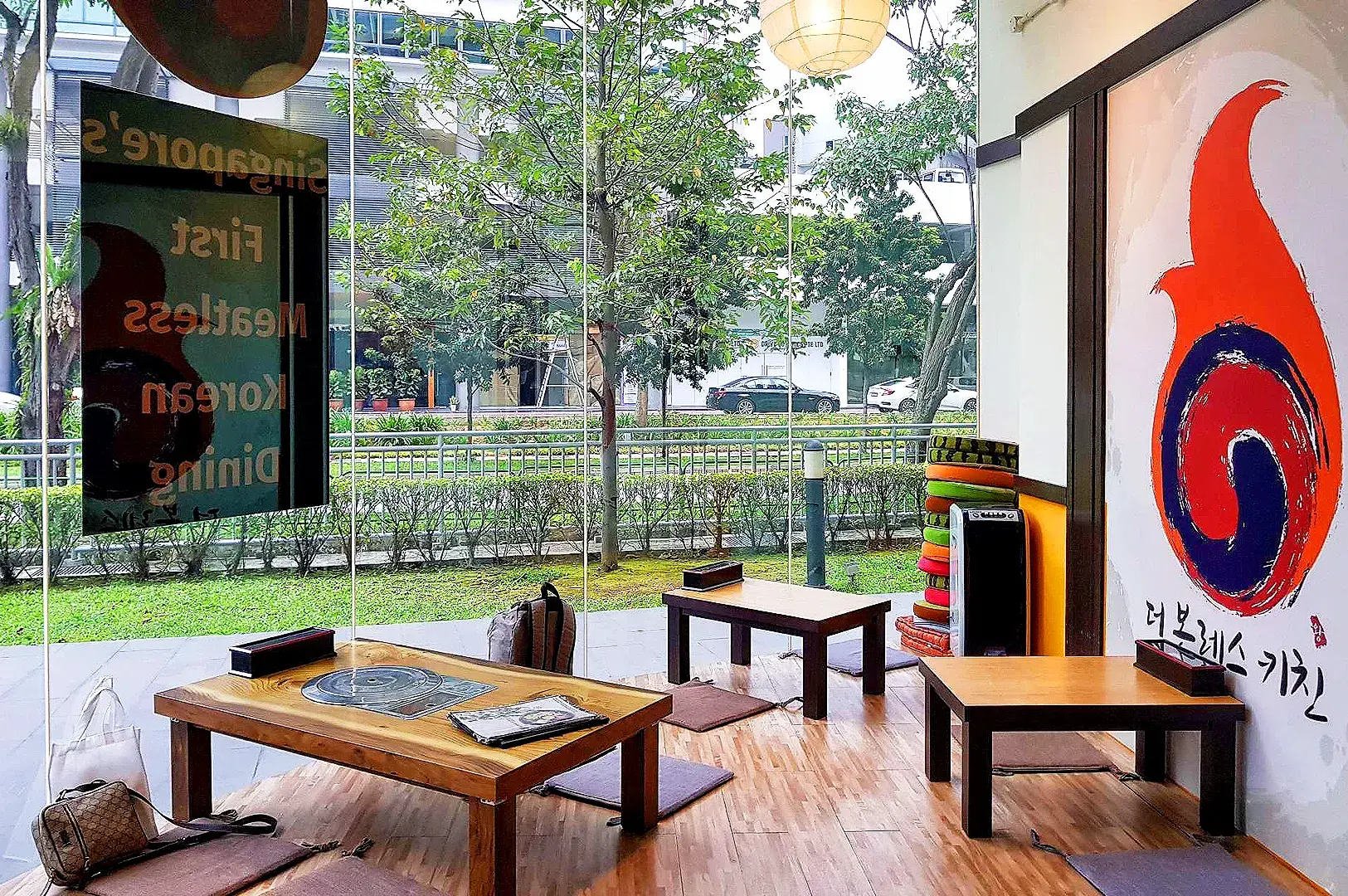 Traditional Korean-inspired dining area at The Boneless Kitchen Singapore with floor seating and minimalist interior.
