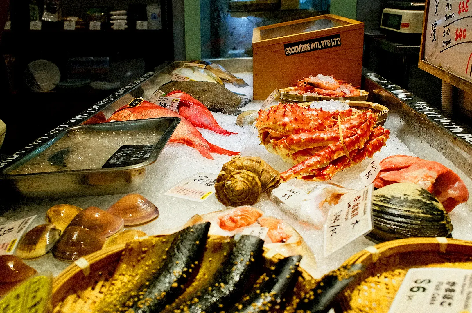 Fresh Japanese seafood display at Araya Shouten Singapore with king crab, salmon, shellfish and other seafood on ice