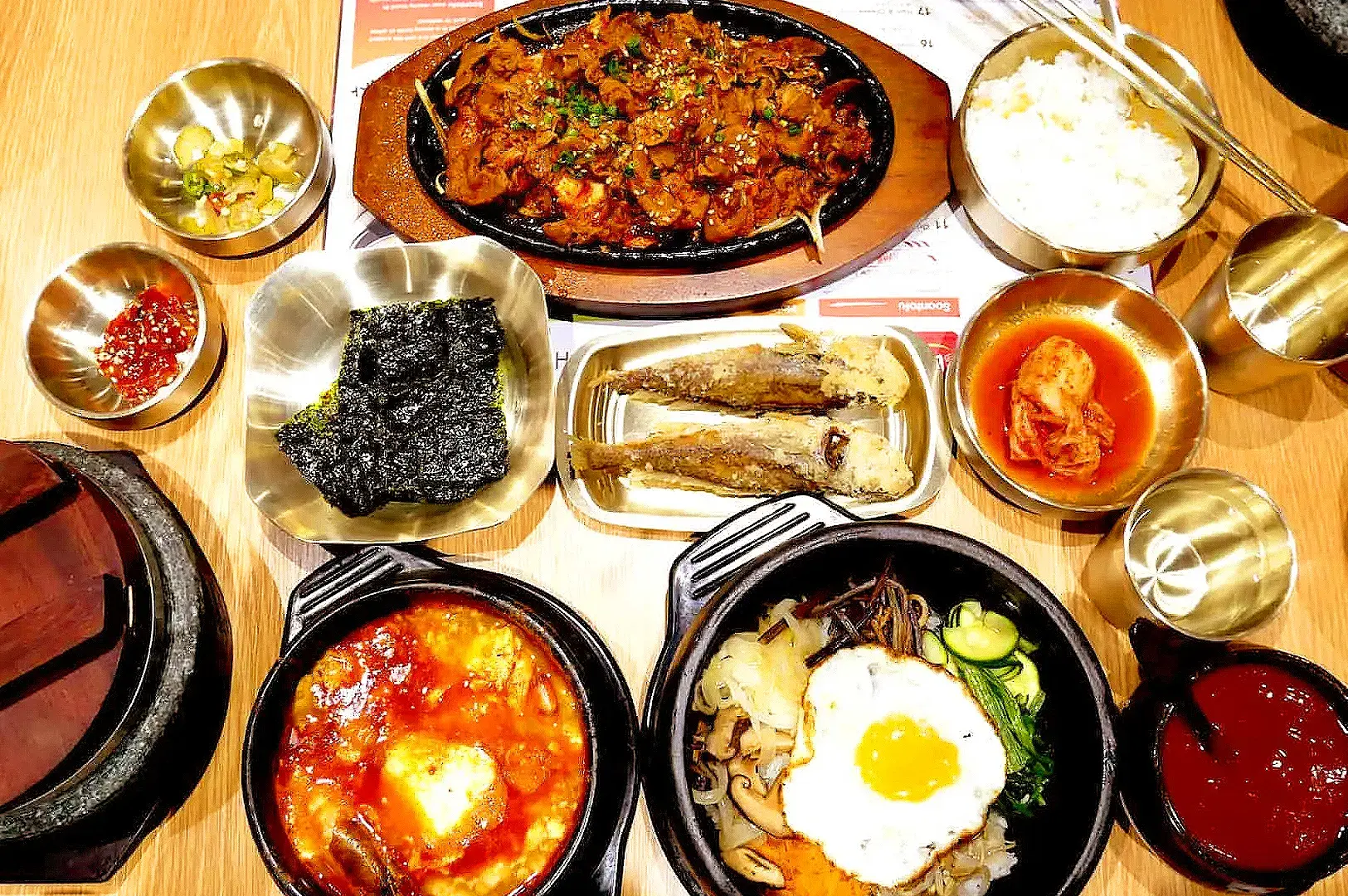 SBCD Korean Tofu House meal with spicy Korean dishes, rice, kimchi, seaweed, and banchan