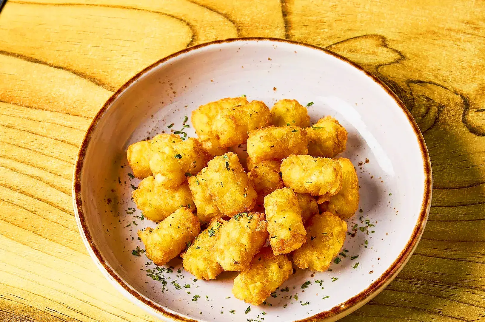 Crispy fried tofu bites at The Boneless Kitchen Singapore, a popular Korean vegetarian side dish.