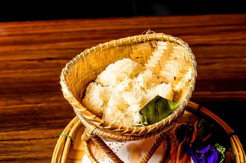 Chiang Mai sticky rice served in a traditional bamboo basket, showcasing authentic Northern Thai cuisine