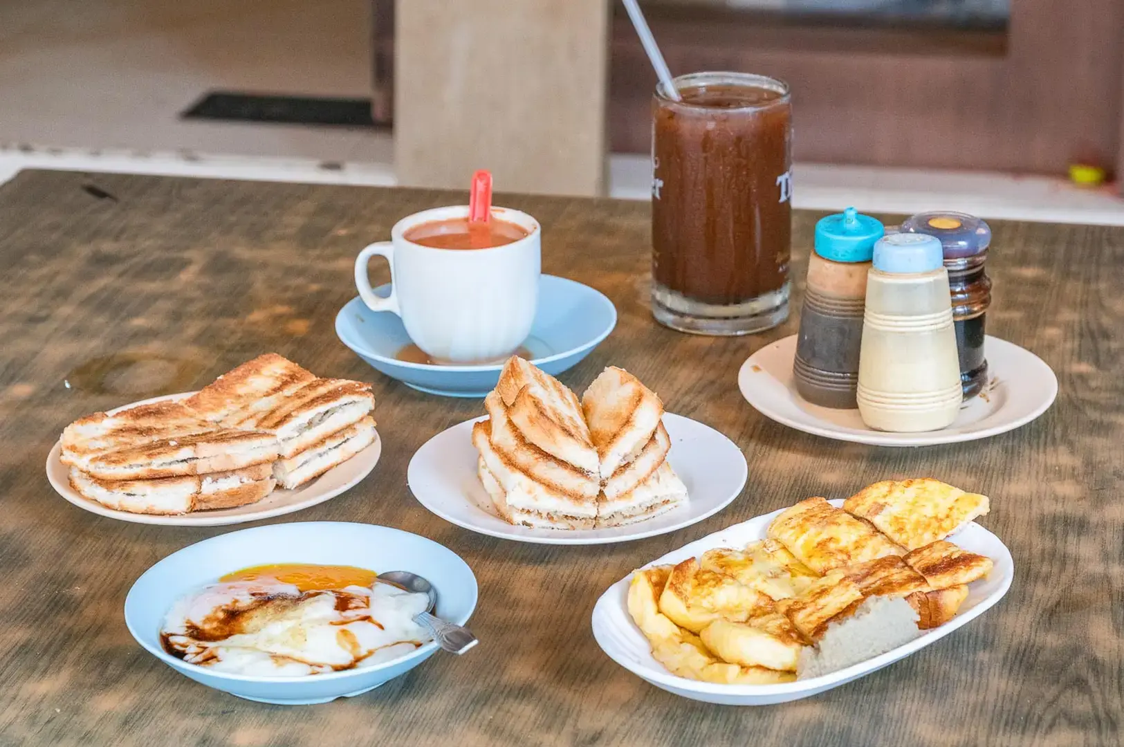 Tong Ah Eating House Singapore traditional breakfast set with kaya toast, coffee, eggs and toasted sandwiches