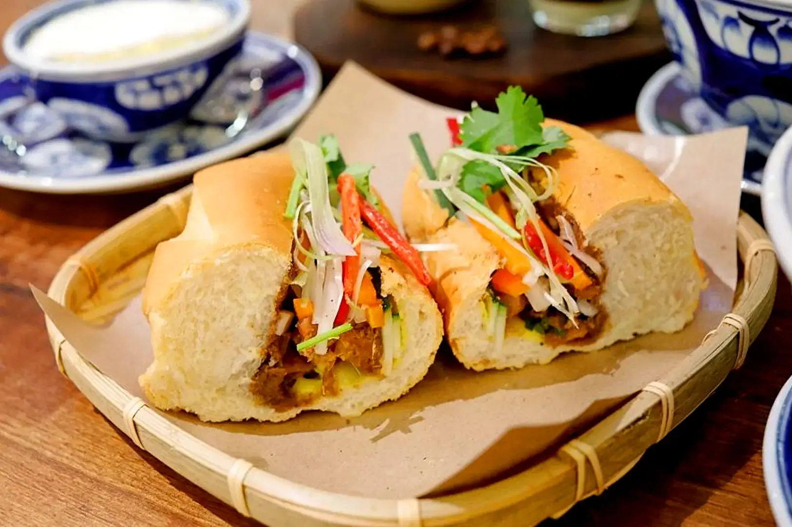 Co Chung Vietnamese banh mi sandwich with vegetables, herbs and Vietnamese-style filling
