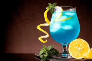 Blue citrus cocktail with lemon and mint at a Singapore bar