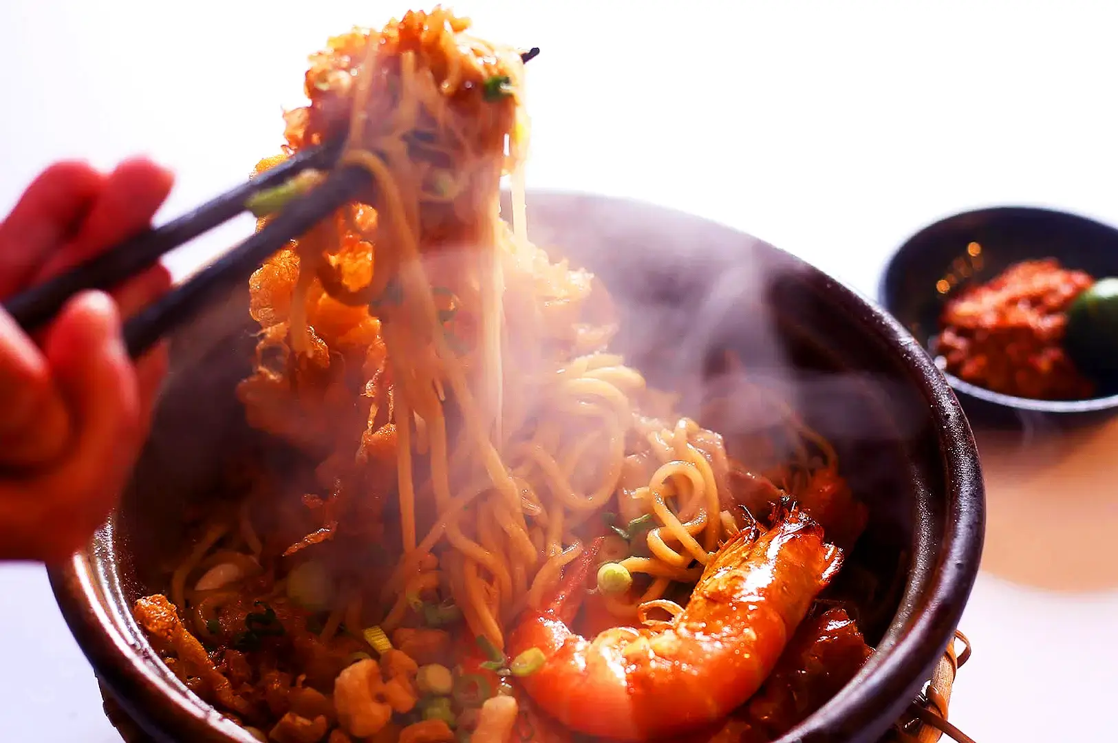 Hup Lok Singapore seafood noodles with prawns, fish and vegetables served hot in a bowl