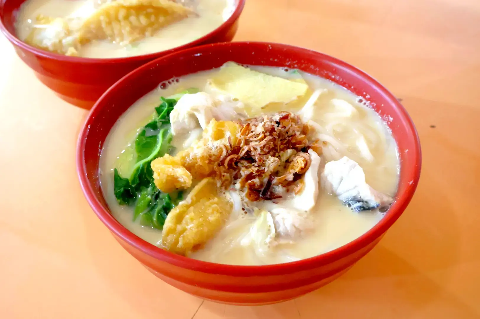Tiong Shian Porridge Centre Singapore fish porridge with fried dough, vegetables, fish and crispy shallots