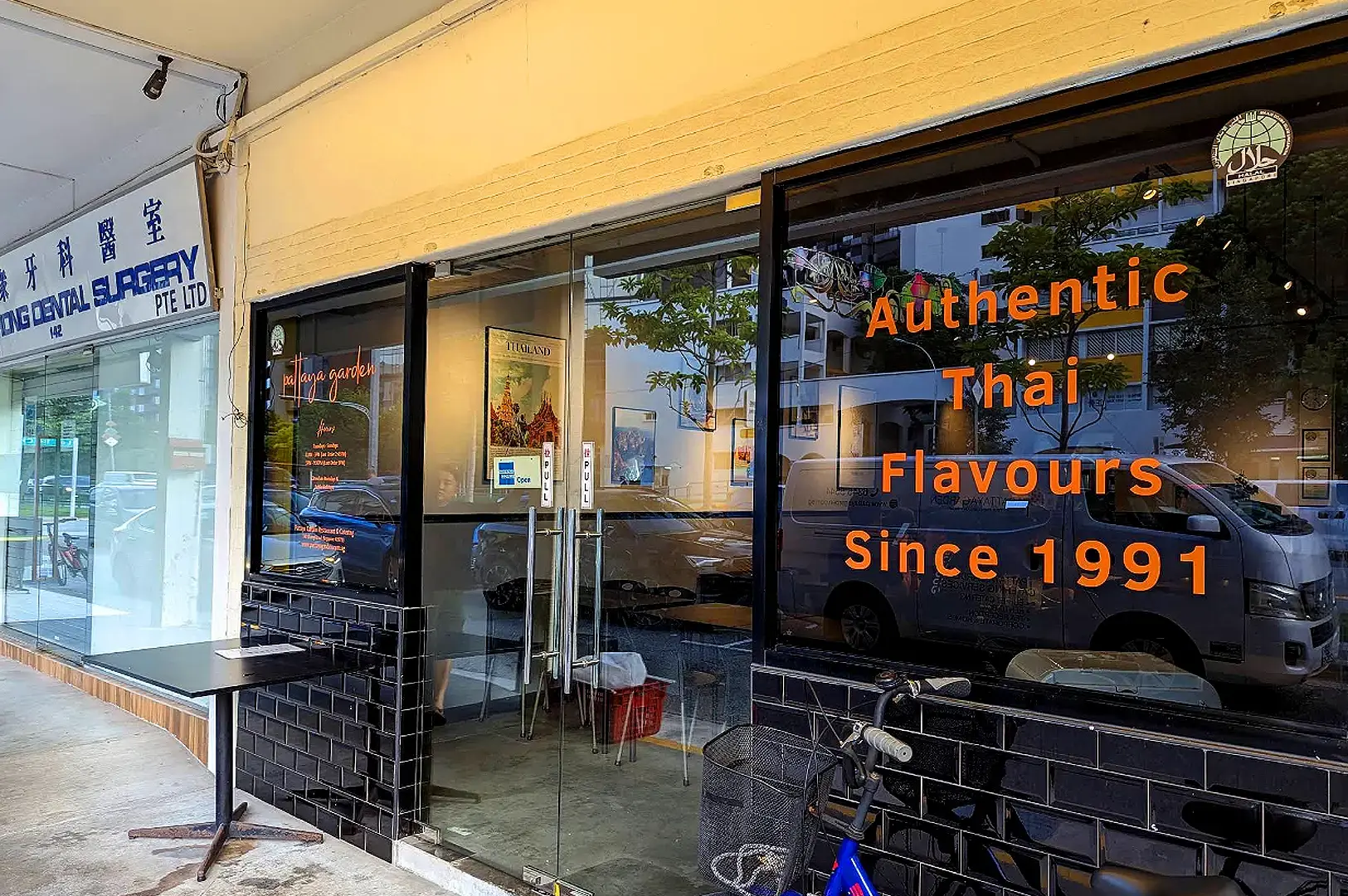 Pattaya Garden Restaurant storefront with authentic Thai flavours signage, glass doors and outdoor dining