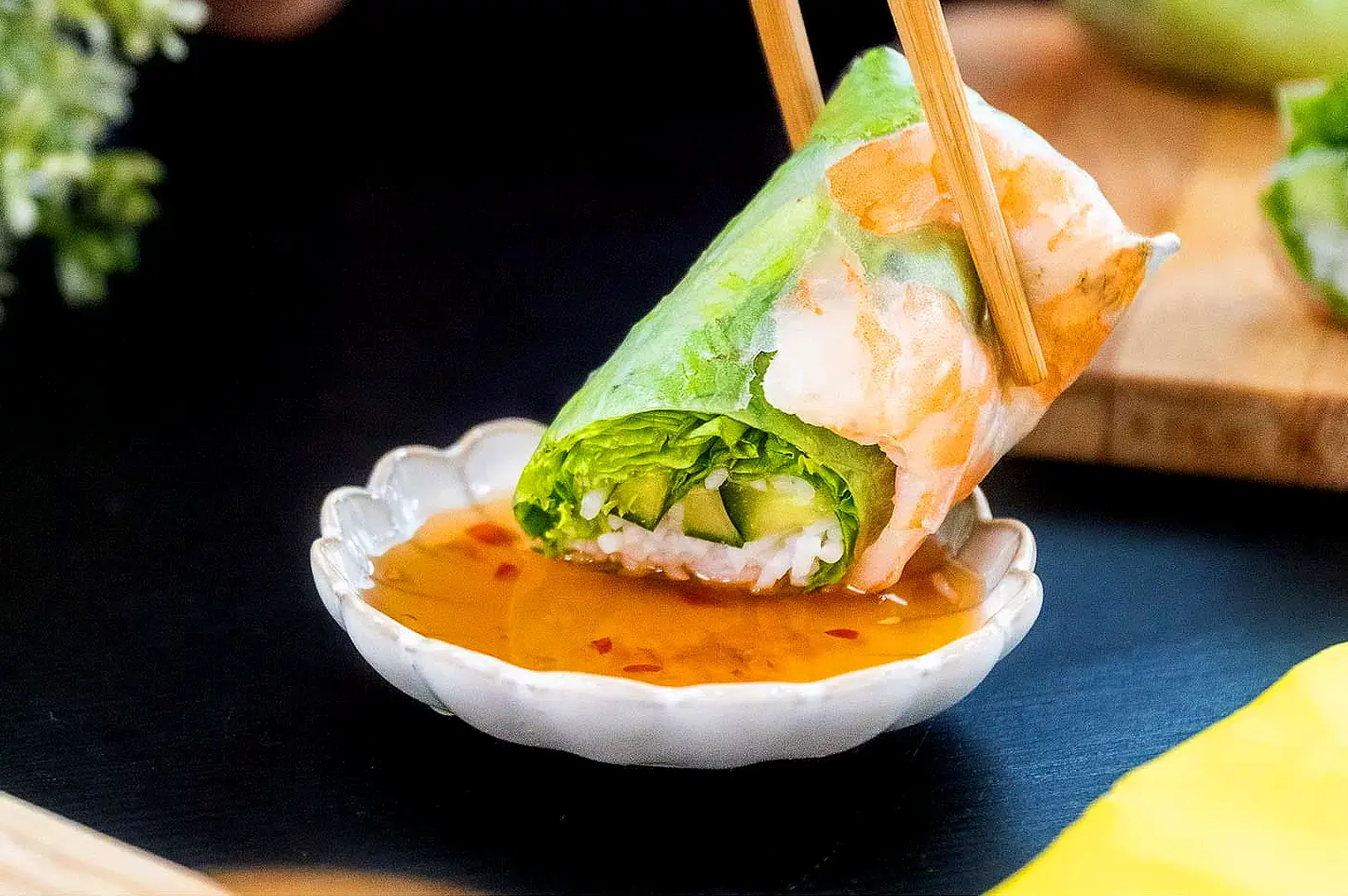 Fresh Vietnamese spring roll with shrimp, lettuce, herbs and rice noodles dipped in Vietnamese sauce