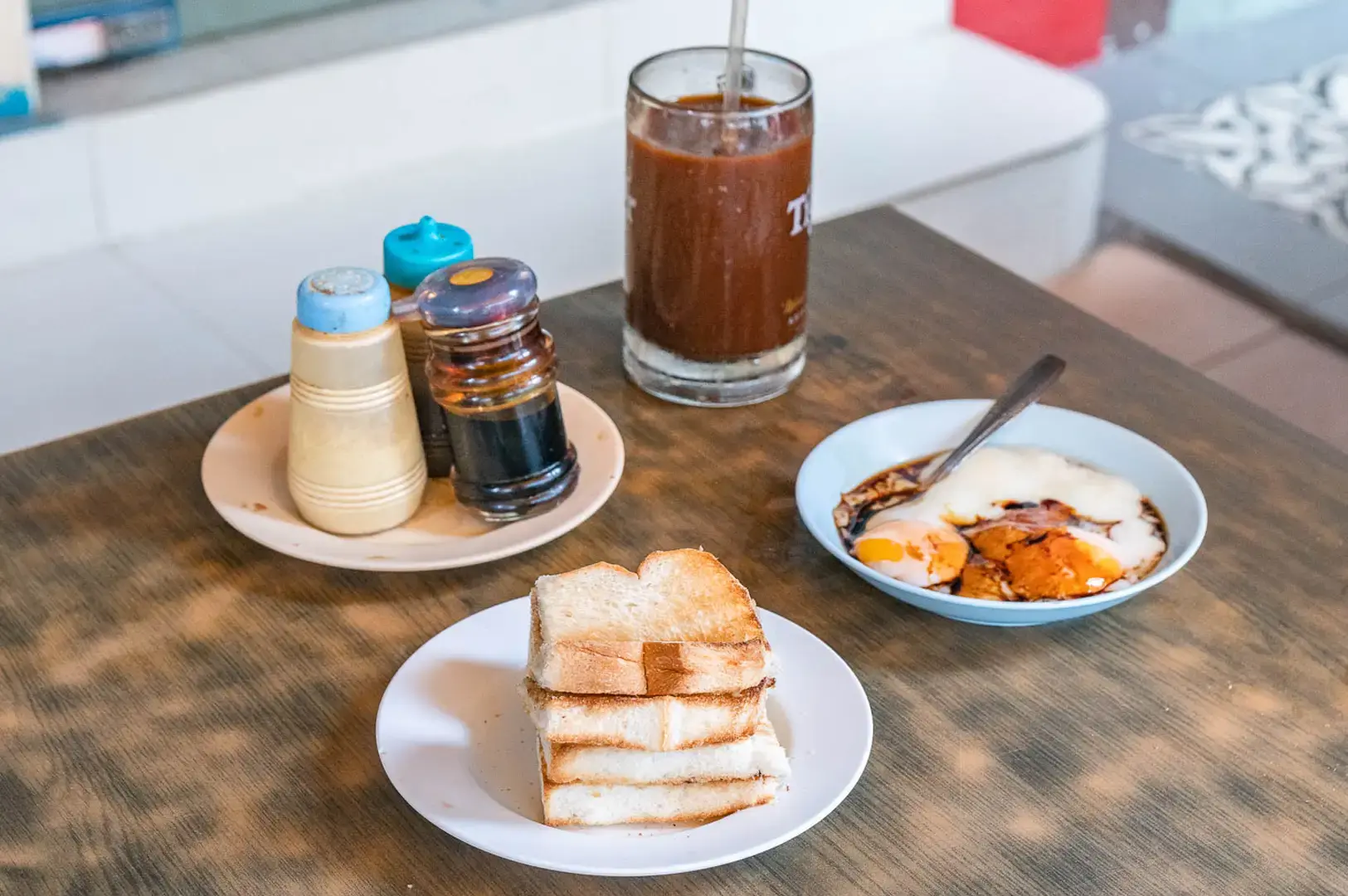 Tong Ah Eating House Singapore kaya toast, soft-boiled eggs and kopi served for a traditional Chinatown breakfast
