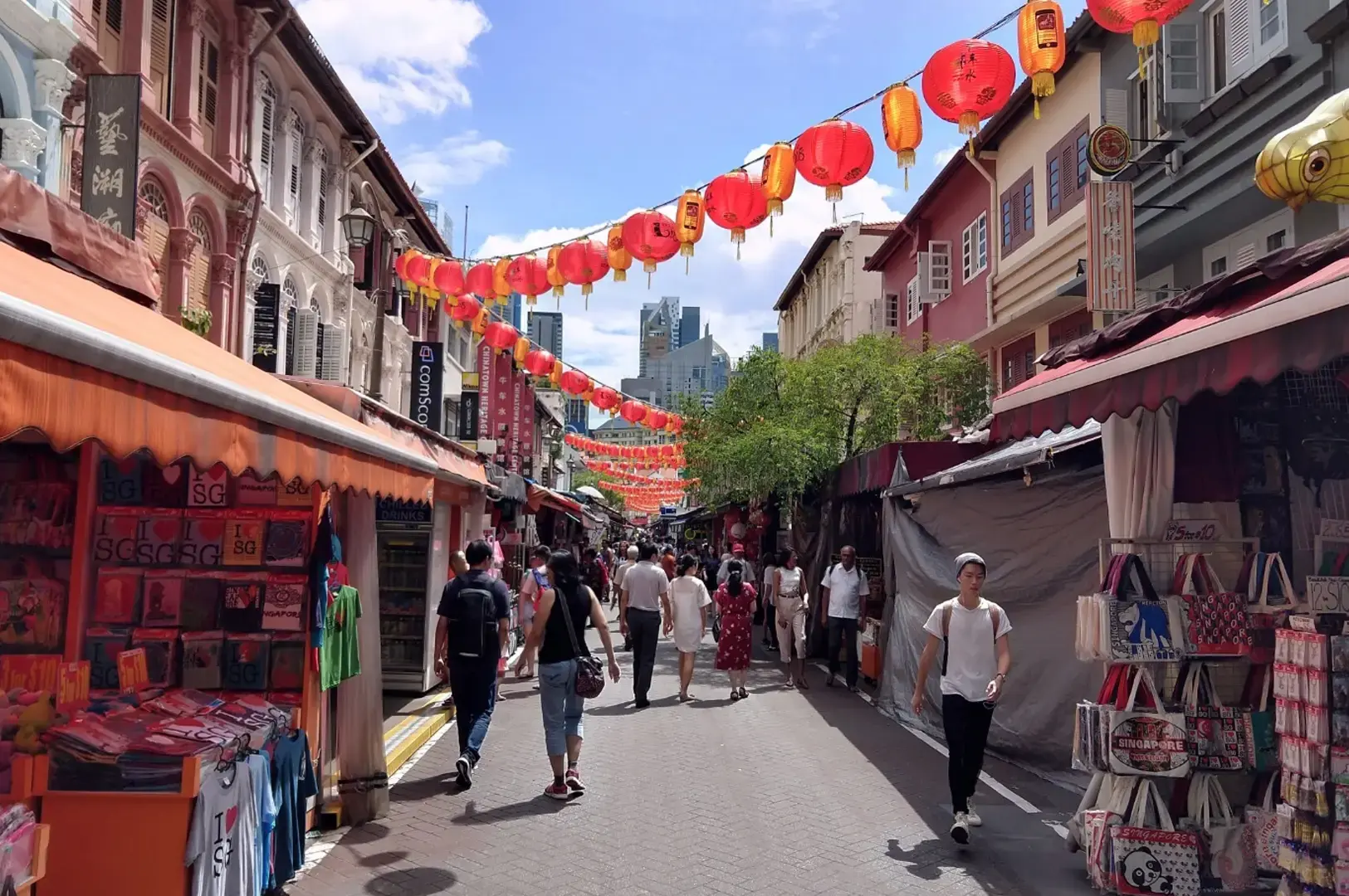 Chinatown Singapore street market lined with heritage shophouses, red lanterns and bustling food stalls