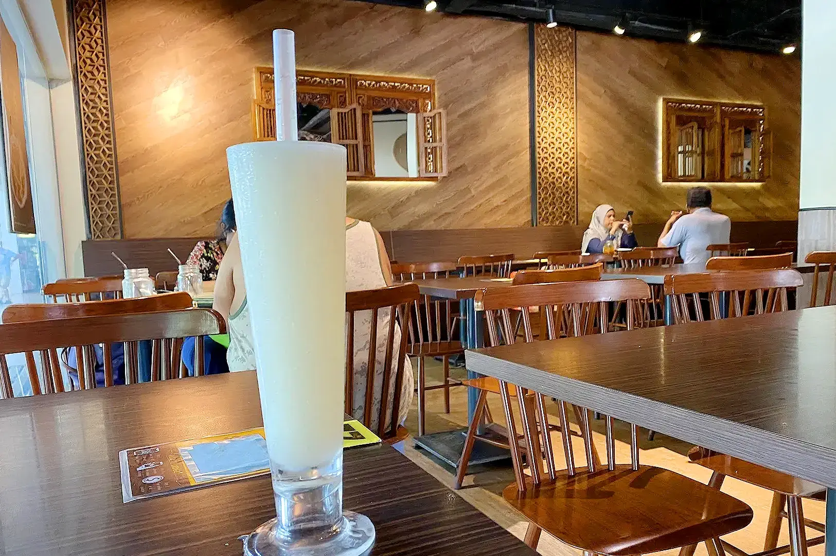 Yassin Kampung Seafood Admiralty Singapore dining table with refreshing drink and traditional restaurant interior