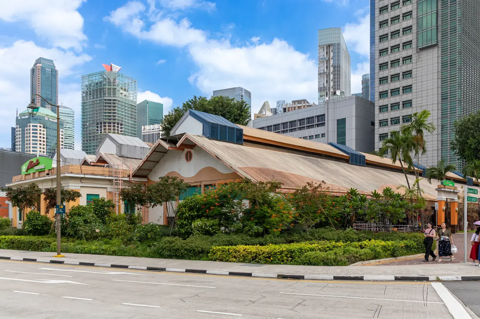 Singapore Chinatown historic shophouses and modern skyline showcasing the neighborhood's multicultural heritage