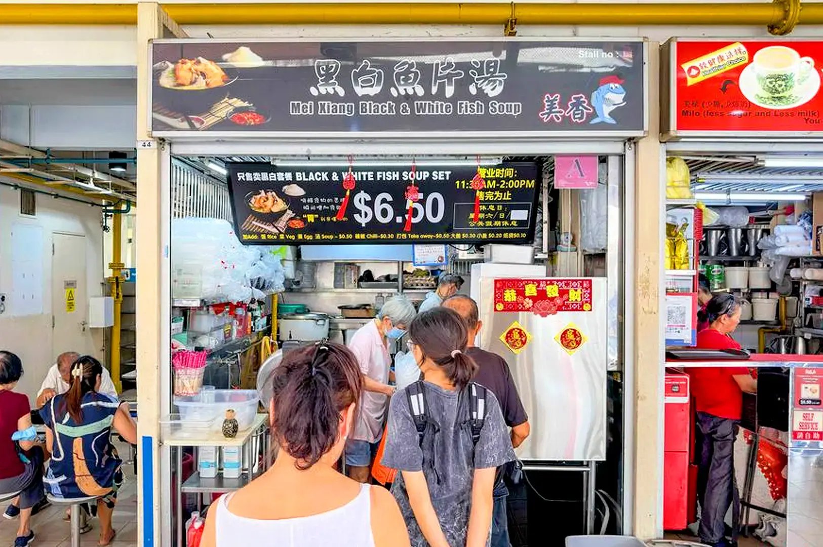 Mei Xiang Black & White Fish Soup Singapore stall with fish soup set menu and customers dining