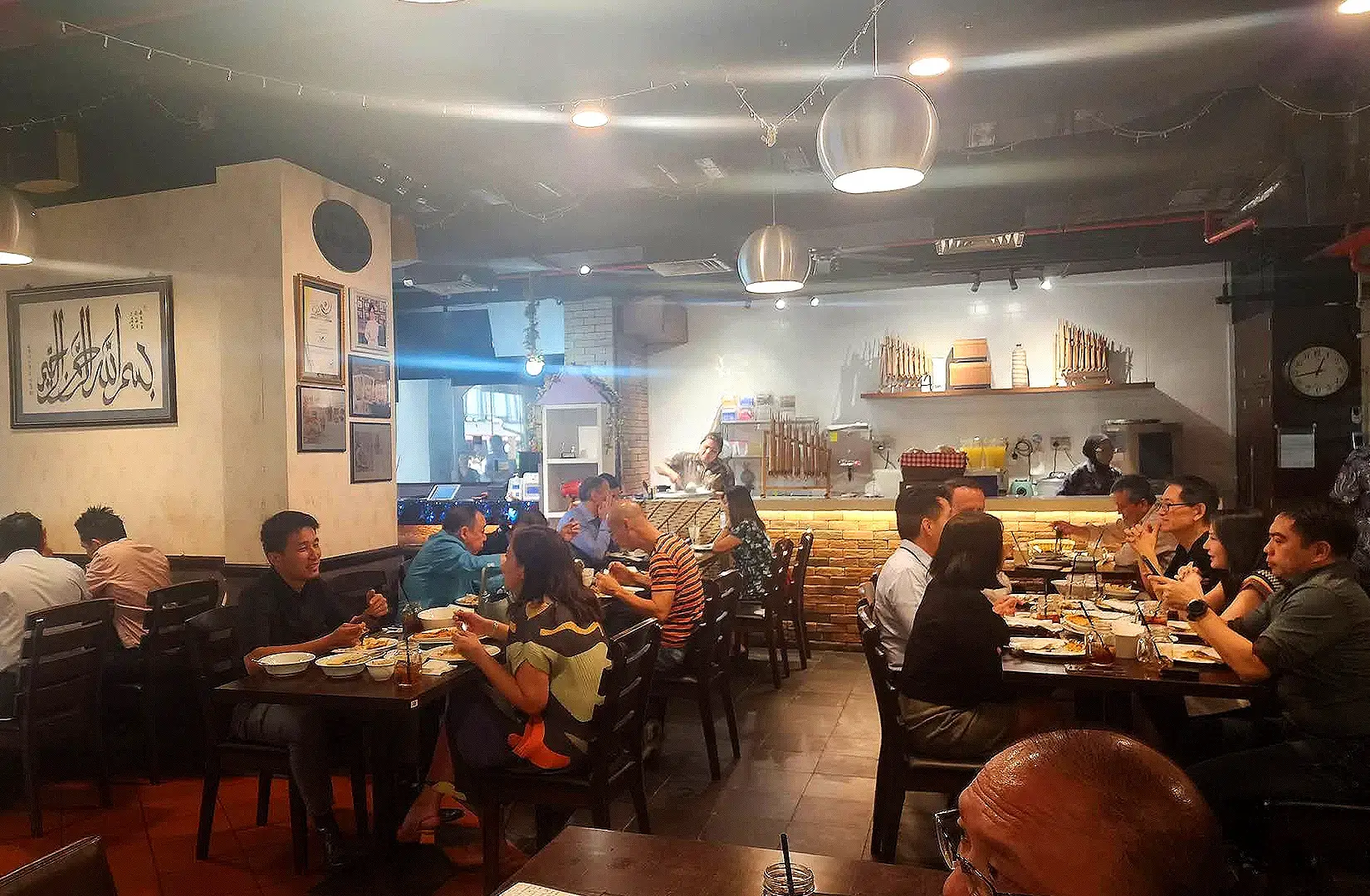 Pagi Sore Indonesian Restaurant Singapore busy dining room with guests enjoying traditional Indonesian food