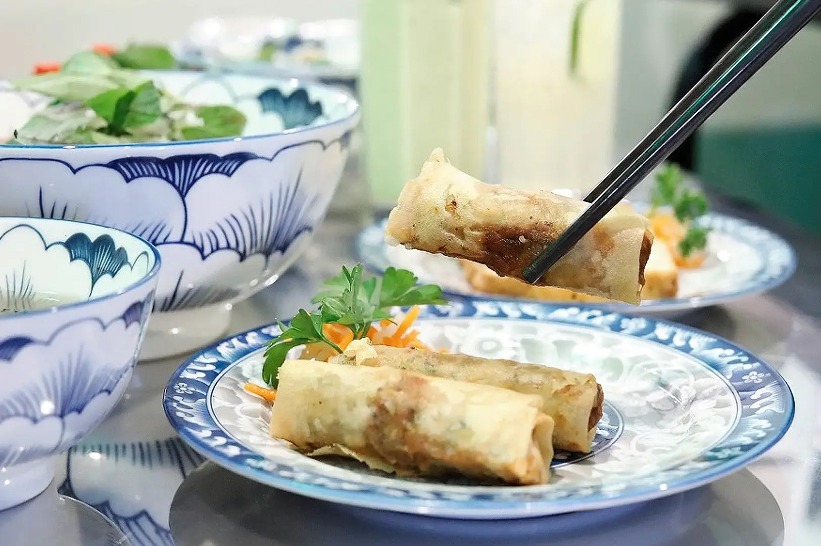 Mrs Pho Singapore crispy Vietnamese spring rolls served with fresh herbs and dipping sauce