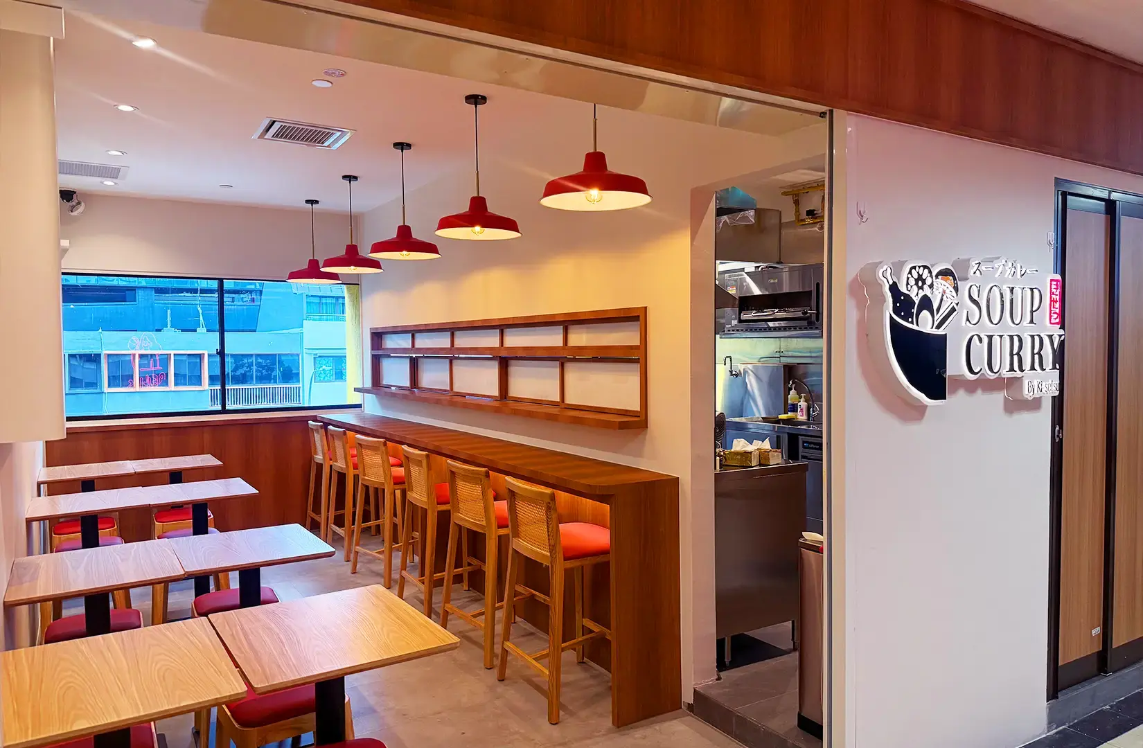 Soup Curry by Ki-setsu Singapore restaurant interior with Japanese dining tables, counter seating and open kitchen
