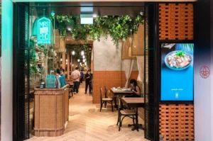 Mrs Pho Somerset Singapore restaurant interior with Vietnamese decor, greenery and warm dining atmosphere