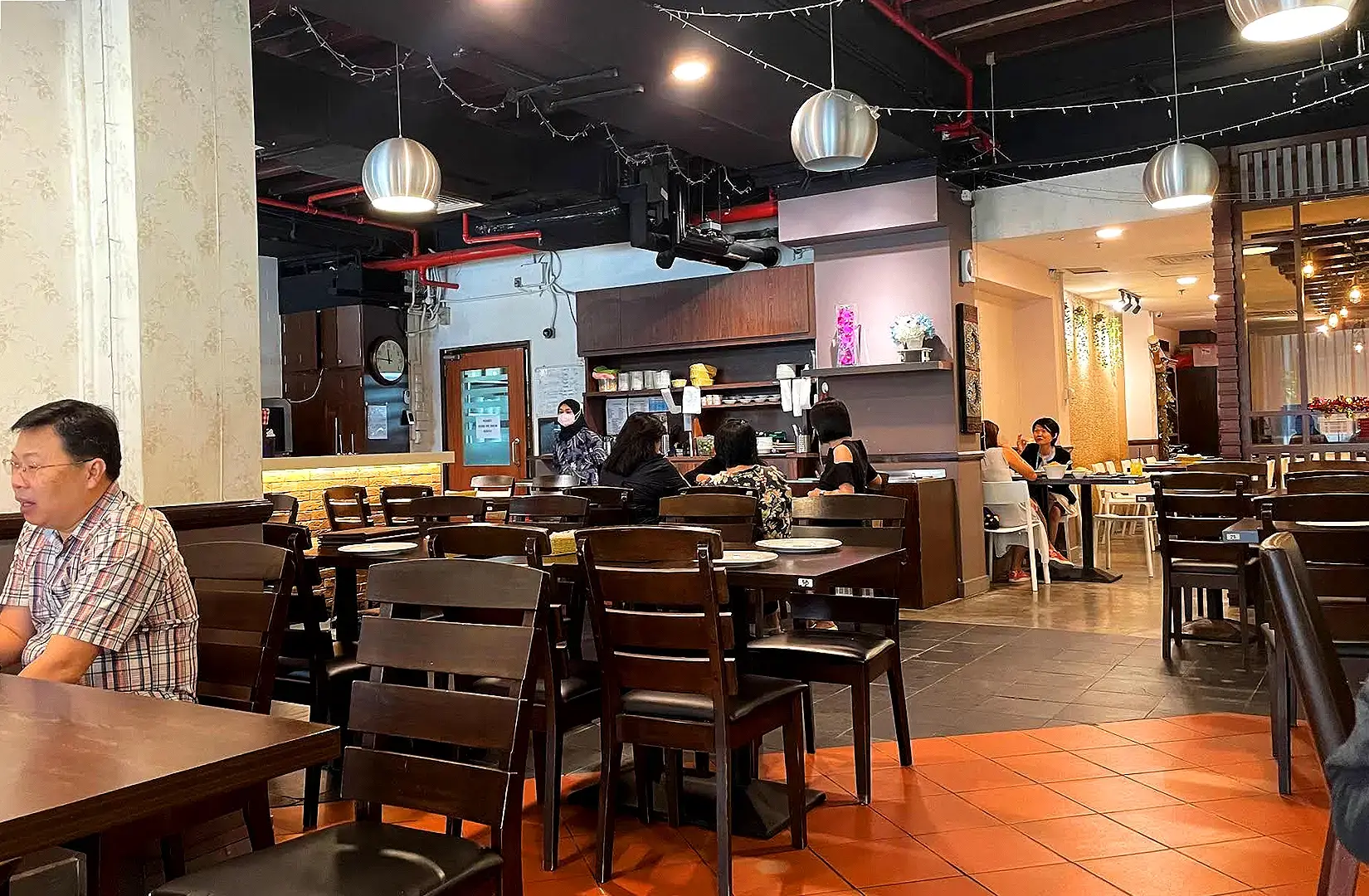 Pagi Sore Indonesian Restaurant Singapore dining area and open service counter with traditional Indonesian restaurant interior