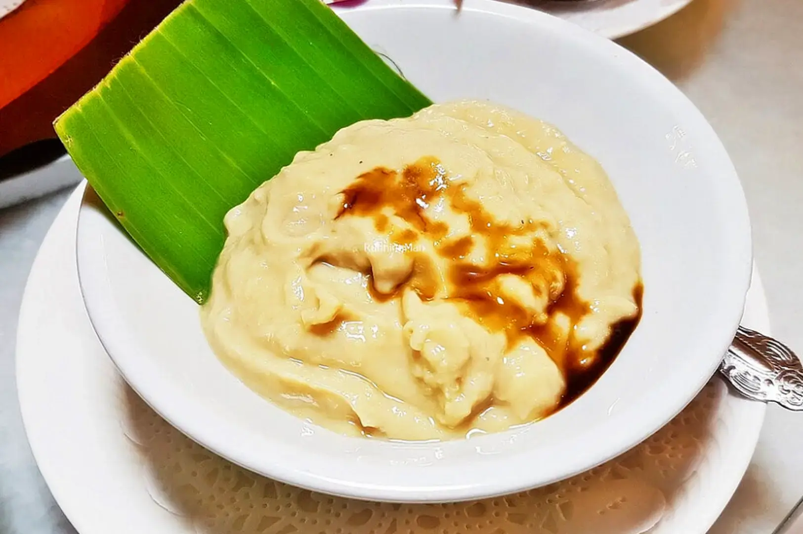 Indonesian dessert served with palm sugar syrup and banana leaf at Kintamani Singapore restaurant