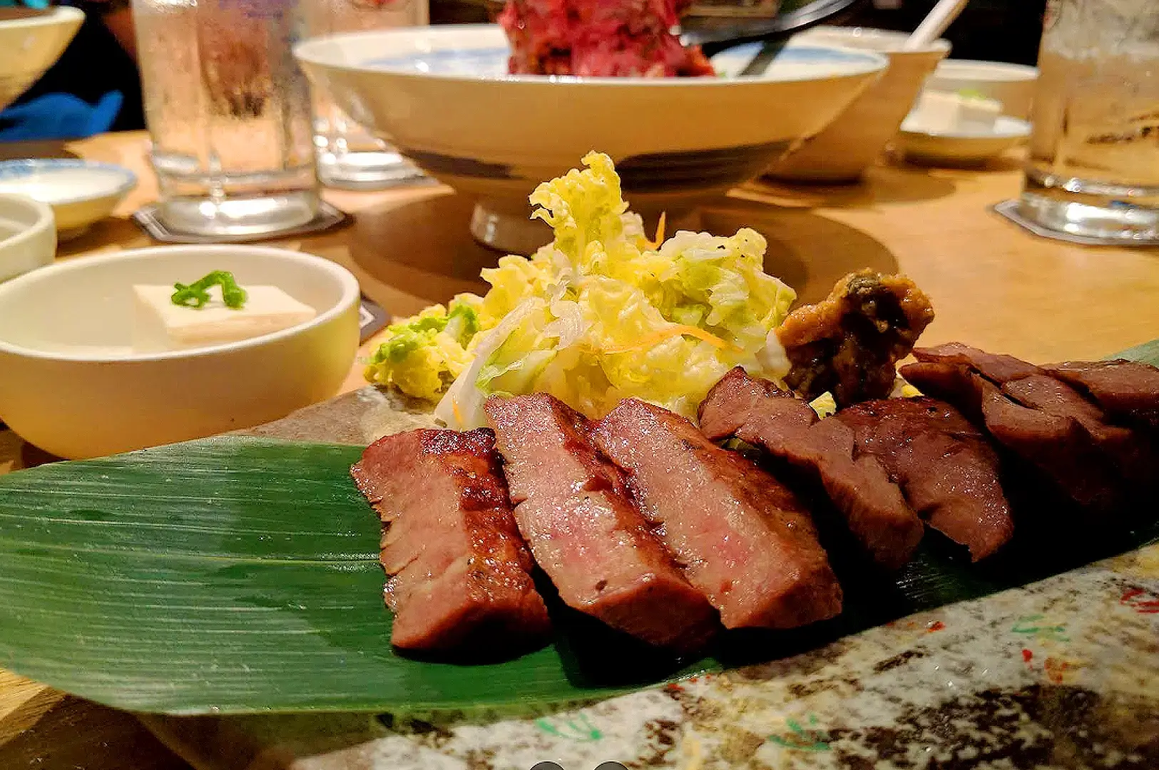 Sandaime Bunji grilled beef tongue slices served with cabbage and Japanese side dishes in Singapore