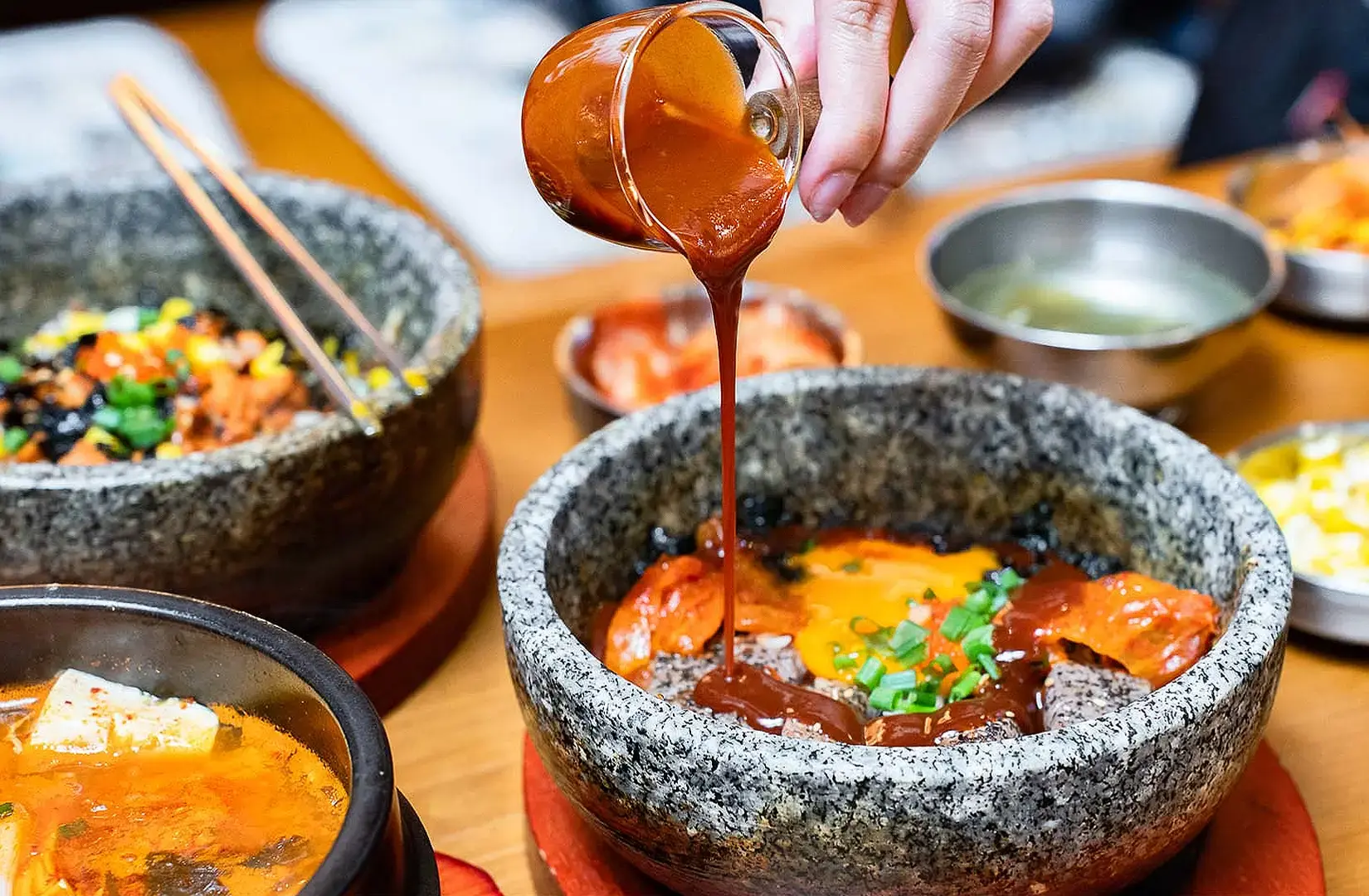 Halal Korean food in Singapore with stone bowl bibimbap, Korean side dishes and spicy sauce
