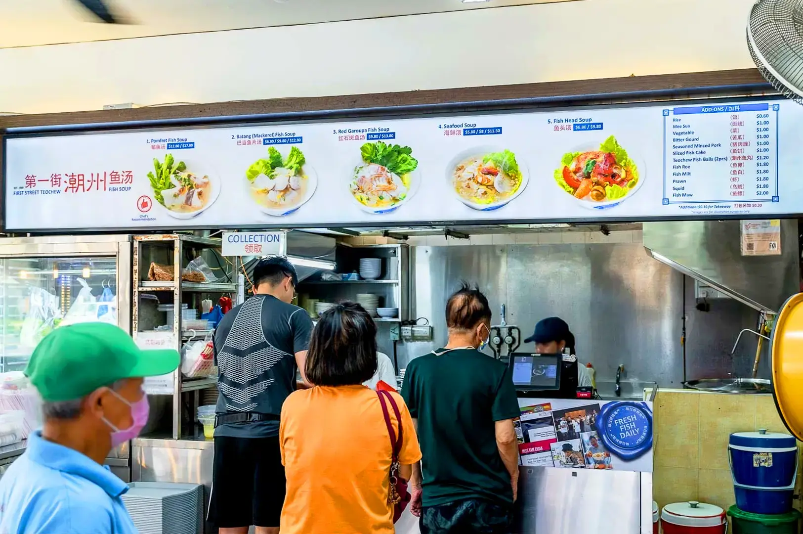 First Street Teochew Fish Soup Singapore stall with fish soup menu and customers at the counter