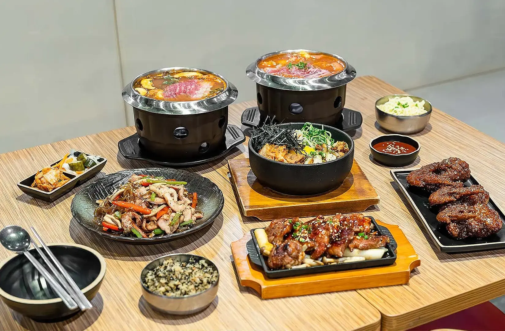 Halal Korean food feast in Singapore with kimchi stew, grilled meat, bibimbap, banchan and Korean dishes